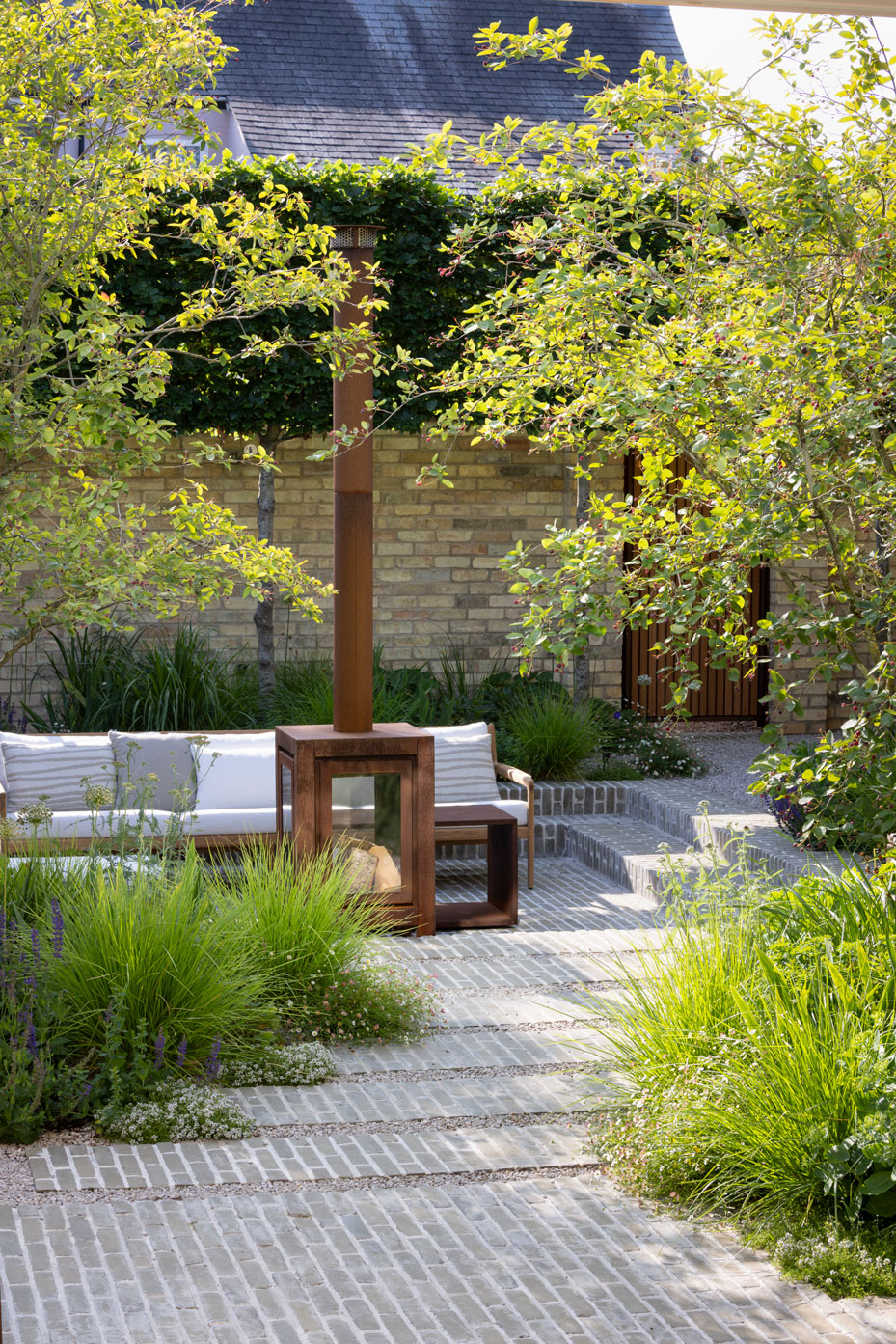 Colm Joseph Cambridge courtyard garden design sunken seating area clay paver path