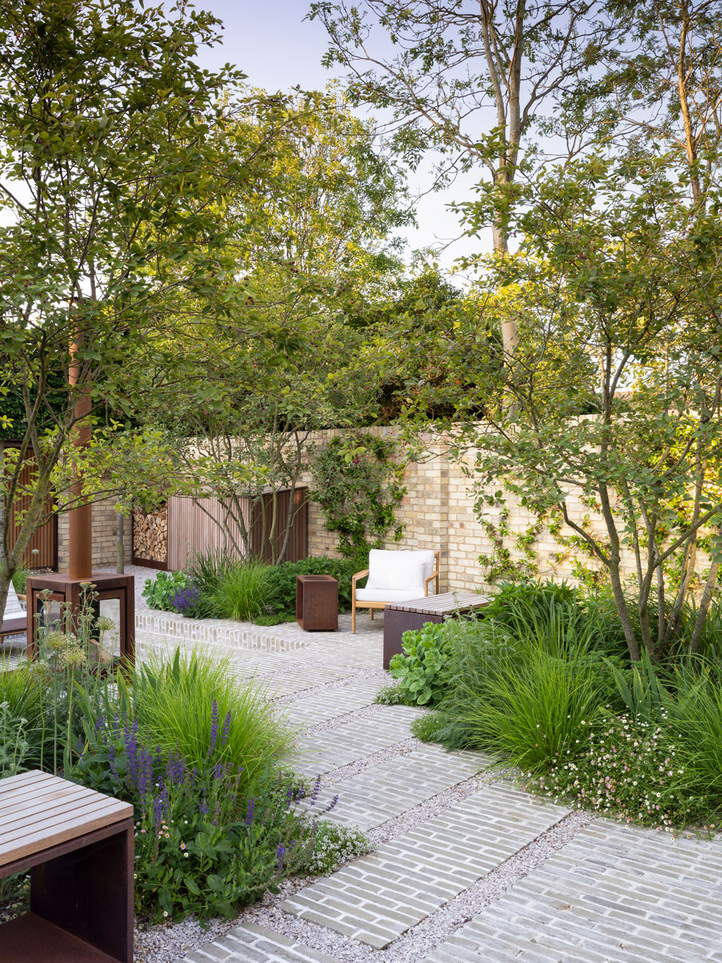 Colm Joseph Cambridge courtyard garden design seating area clay pavers multi-stem amelanchier trees