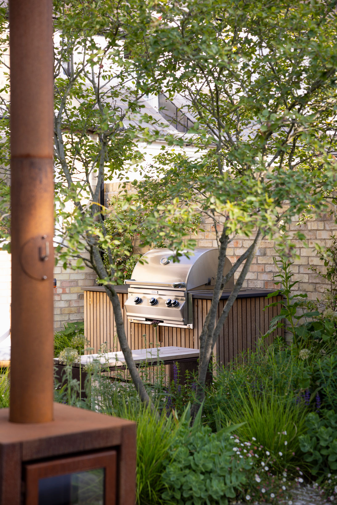 Colm Joseph Cambridge courtyard garden outdoor kitchen natural planting