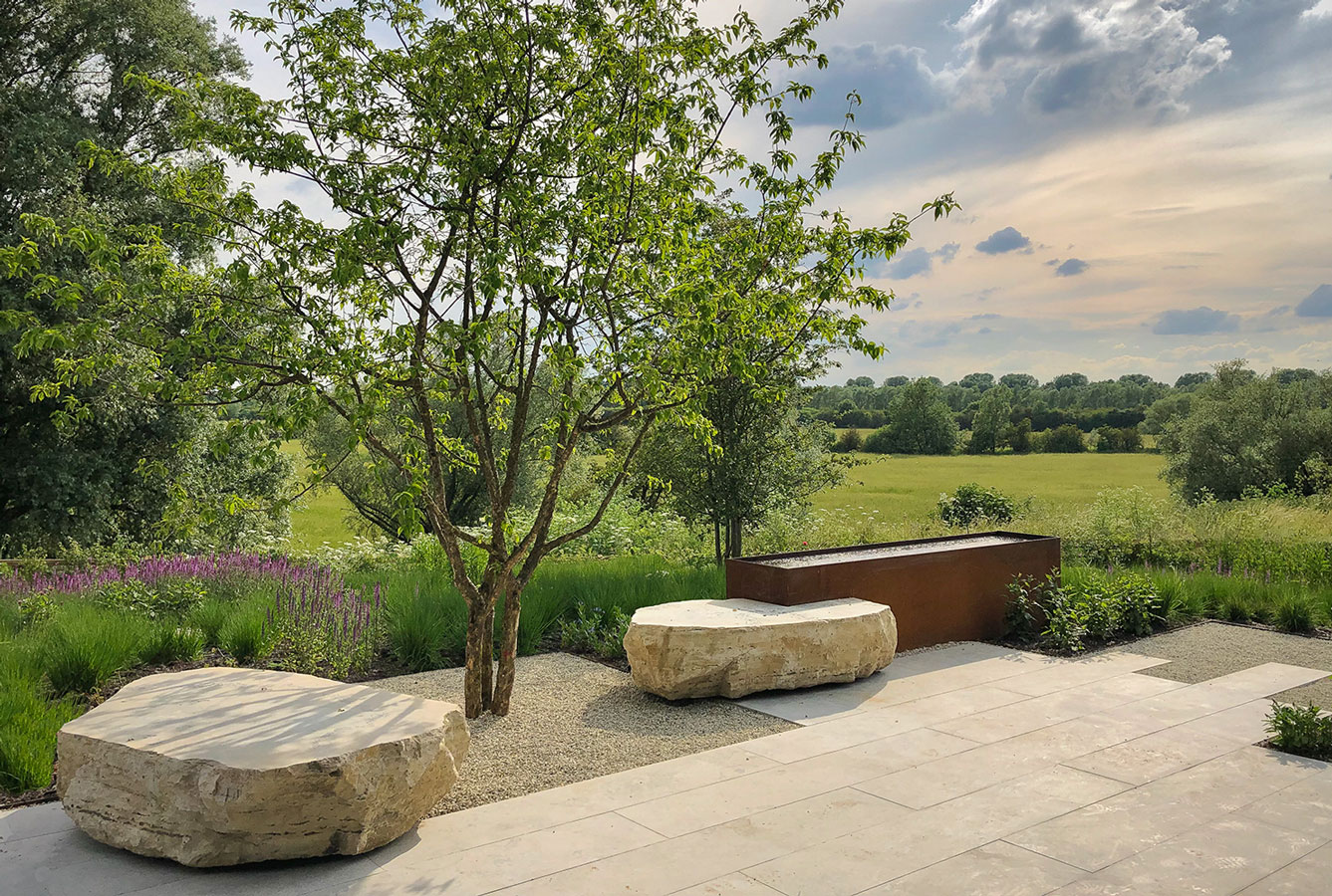 Colm Joseph Gardens - cambridgeshire garden designer main terrace limestone paving corten steel water feature rose meadow contemporary landscape design